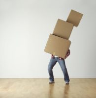 holding moving 3 boxes Why you need to pack for storage carefully.