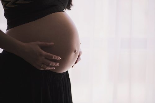 A pregnant woman thinking about moving while pregnant