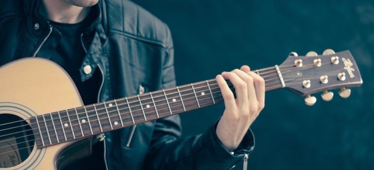 A man playing a guitar. 