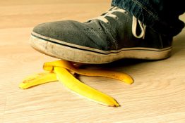 A foot stepping on a banana peel