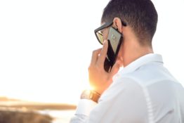 calling movers A man talking on the phone