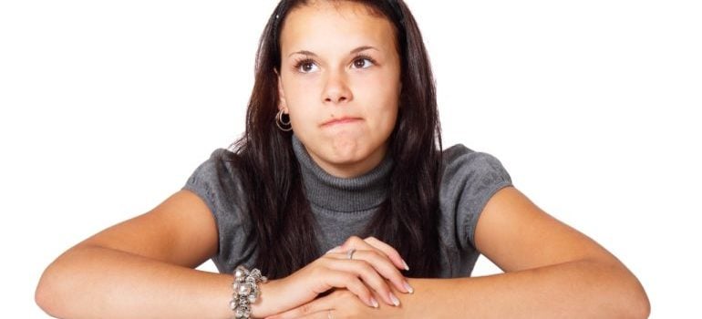 woman thinking about Brooklyn vs Long Island