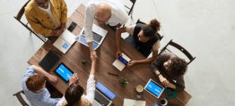 people in a meeting discussing office move