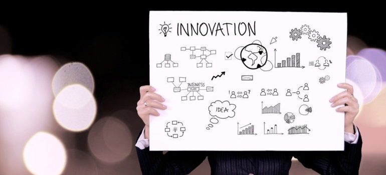A man holding an innovation chart.