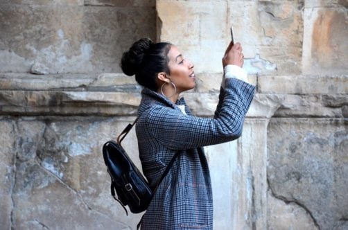 A woman taking a photo.
