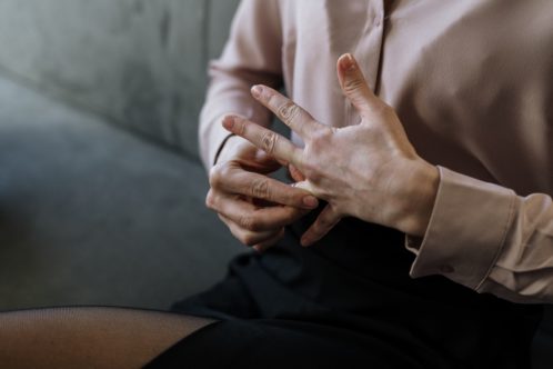 a man taking off his wedding ring