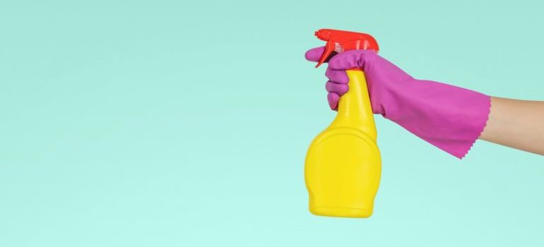 a woman holding a product for cleaning