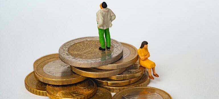 figurines sitting on coins