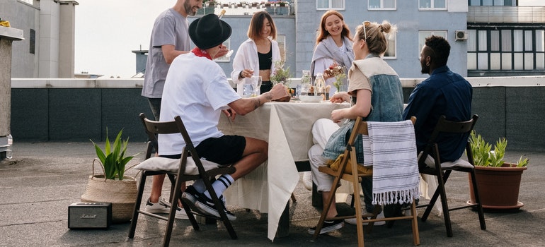 people sitting at the table enjoying Long Island for young professionals