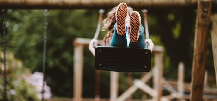 swing woman enjoying a swing