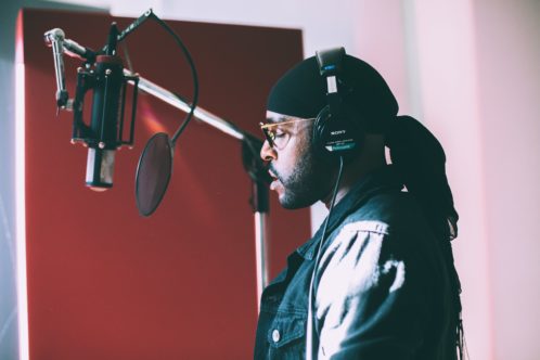 a male singing and thinking about neighborhoods for New York City artists