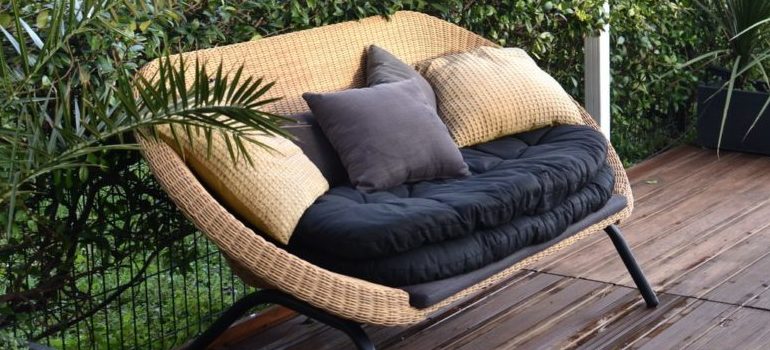 sofa in the backyard - prepare to pack your outdoor furniture for storage