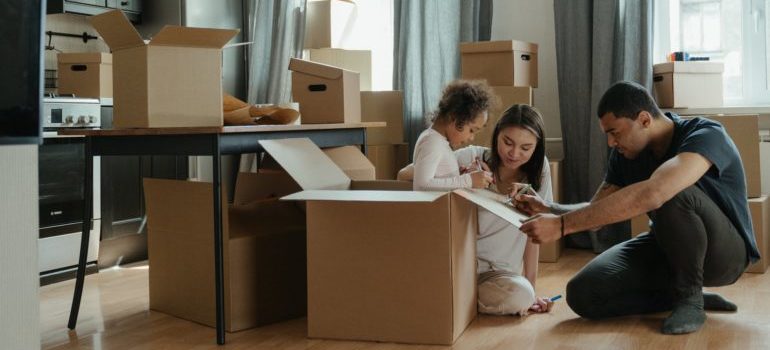 A family packing boxes