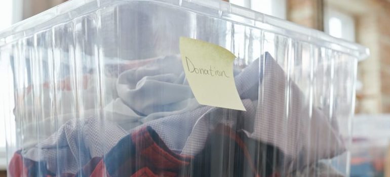 A box with some items. Declutter before you pack your family for relocation to Manhattan