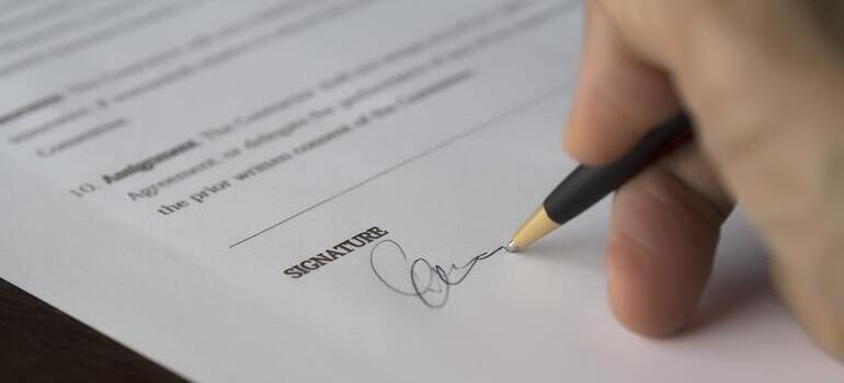 person signing a contract