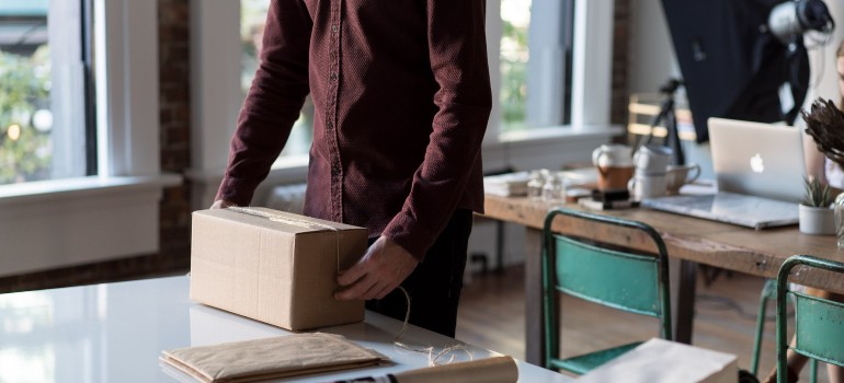 a man packing an item in his office