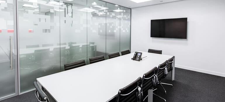 rearranging your new office in Manhattan that has a big white table