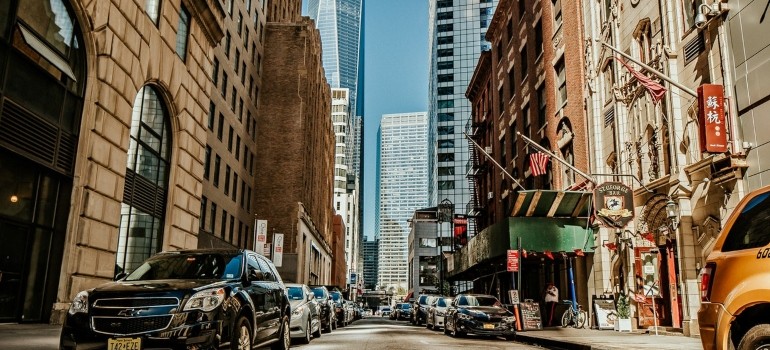 Vehicles parked at the side of the street in one of the most popular NYC neighborhoods