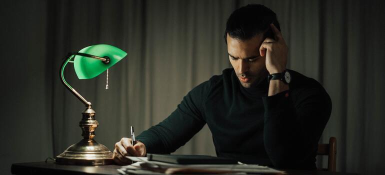 man sitting in dark