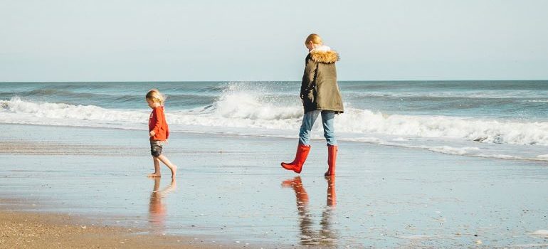 mom and daughter on the beach