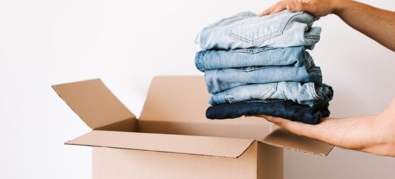 Putting jeans in the box and pack when you're in a clutch